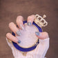 Short Squared Oval Light Blue Press On Nails with Waves and Crystals