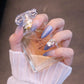 Long Almond Periwinkle Blue Press On Nails with Flower and Crystal Charms