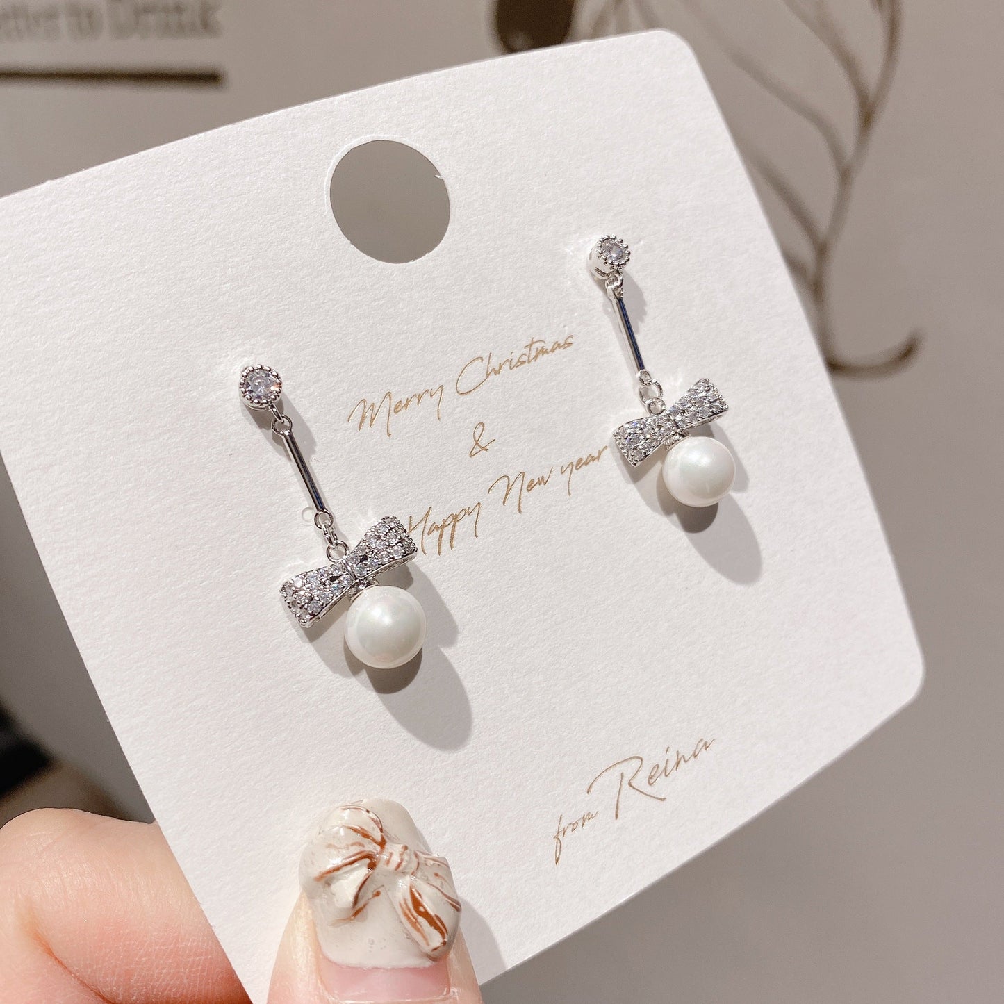 Pearl and Bow Silver Dangle Earring