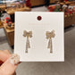 Crystal Embellished Bow Dangle Earrings